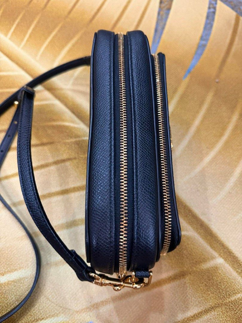 Dior Black Crossbody Bag (Category: Luxury Bags & Wallets) located in Manila. Submitted by personalprelovedmnl (Listing ID 1435972557, Image 2). Description: - Authentic Dior crossbody bag - Black leather exterior - Gold-tone CD logo - Detachable strap - Multiple compartments with gold zippers - Includes dust bag.