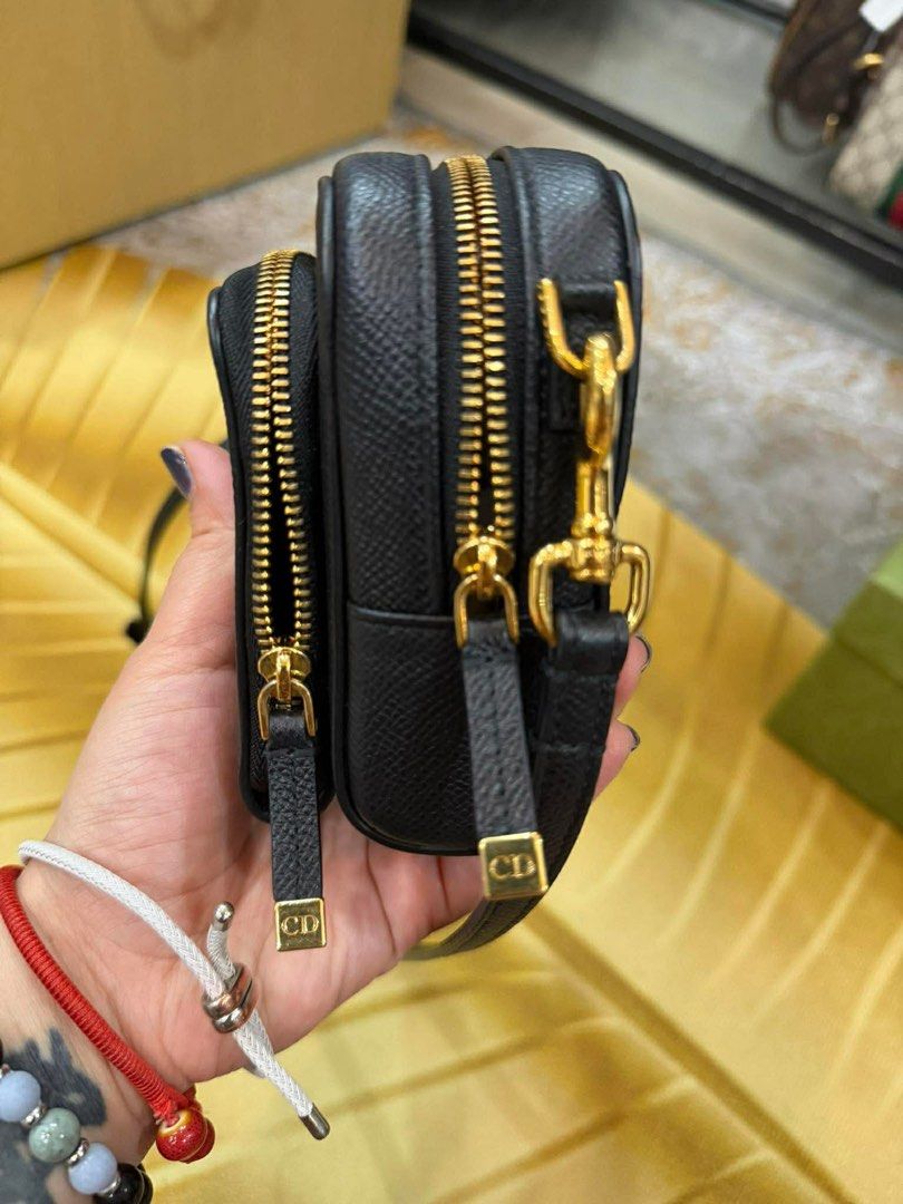Dior Black Crossbody Bag (Category: Luxury Bags & Wallets) located in Manila. Submitted by personalprelovedmnl (Listing ID 1435972557, Image 3). Description: - Authentic Dior crossbody bag - Black leather exterior - Gold-tone CD logo - Detachable strap - Multiple compartments with gold zippers - Includes dust bag.