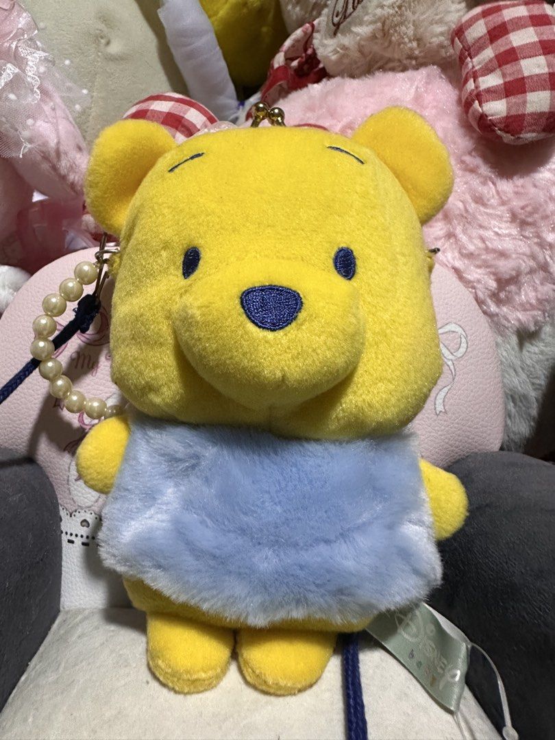 Disney Baby Pooh Bear Bag (Category: Babies & Kids Fashion) located in Legazpi City. Submitted by lgponlineshop (Listing ID 1436097031, Image 1). Description: Adorable Disney Baby Pooh Bear bag. Features a yellow Pooh Bear design with a blue outfit. Includes a pearl strap and a clasp closure. The bag has a tag that says "Funny & Cute Series". Perfect for Disney fans..