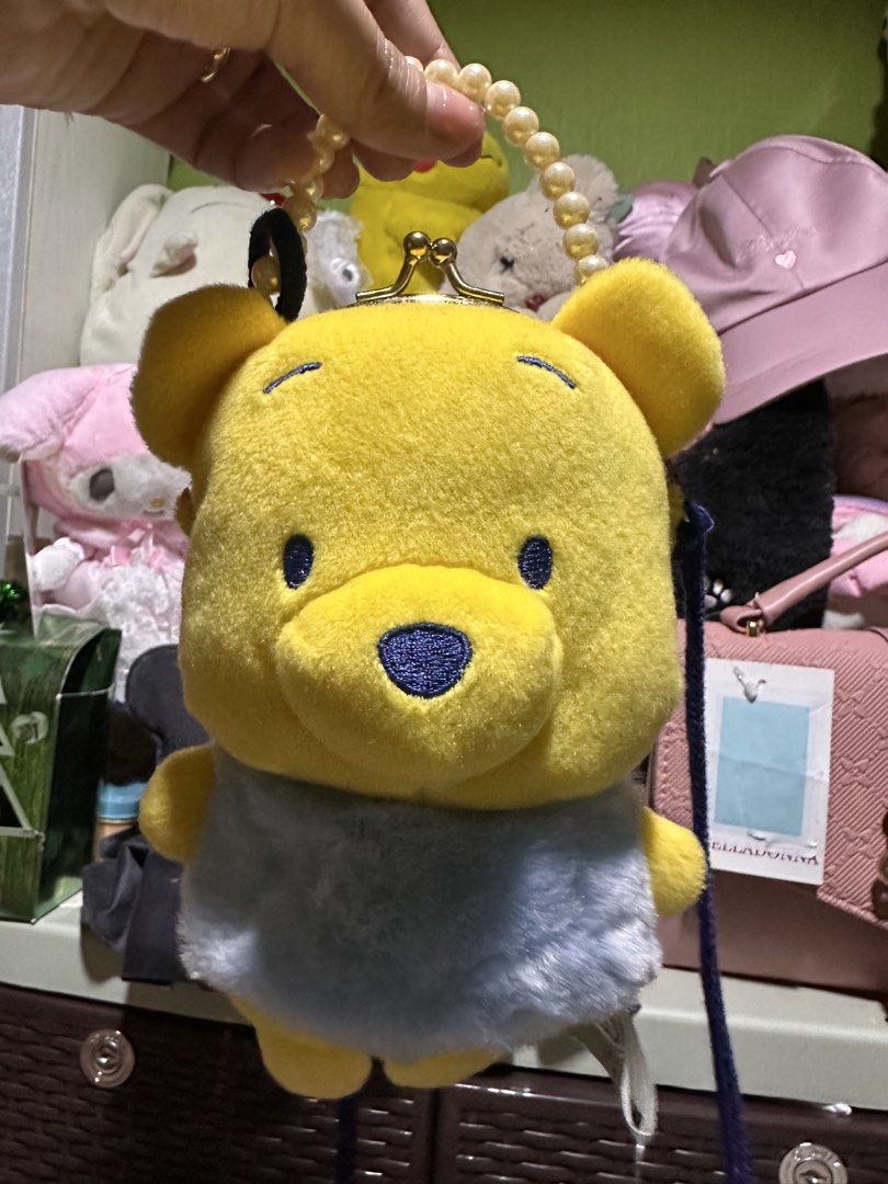 Disney Baby Pooh Bear Bag (Category: Babies & Kids Fashion) located in Legazpi City. Submitted by lgponlineshop (Listing ID 1436097031, Image 2). Description: Adorable Disney Baby Pooh Bear bag. Features a yellow Pooh Bear design with a blue outfit. Includes a pearl strap and a clasp closure. The bag has a tag that says "Funny & Cute Series". Perfect for Disney fans..