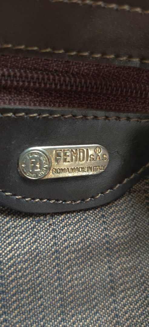 Fendi Brown FF Logo Tote Bag (Category: Luxury Bags & Wallets) located in Bago City. Submitted by louielinco (Listing ID 1436004979, Image 2). Description: - Vintage Fendi tote bag - Iconic FF logo pattern - Brown color with gold-tone hardware - Top handle design - Secure zipper closure - Includes metal logo plate: "FENDI S.A.S. ROMA-MADE IN ITALY" - Protective metal feet at the bottom - Made in Italy.