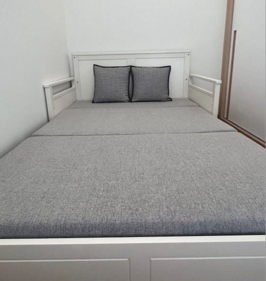 Foldable Sofa Bed (Category: Sofas) located in Singapore. Submitted by bicaiden (Listing ID 1436085264, Image 2). Description: - White sofa bed with grey cushions - Converts easily into a queen size bed - Modern and clean design - Perfect for small spaces or guest rooms - Solid construction.