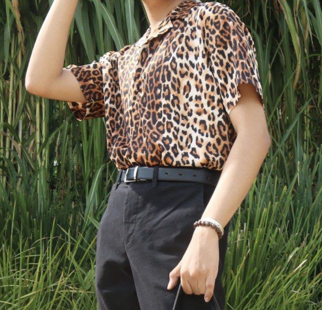 Forever 21 - Leopard Print Silk Shirt - Men's Medium (Category: Tshirts & Polo Shirts ) located in Las Pinas. Submitted by mjpn28 (Listing ID 1436016199, Image 1). Description: - Silk - Rarely used - Forever 21 leopard print shirt - Men's size medium - Classic collared design - Short sleeves - Silky material - Button-down front - Adds a bold statement - Perfect for casual wear or a night out.