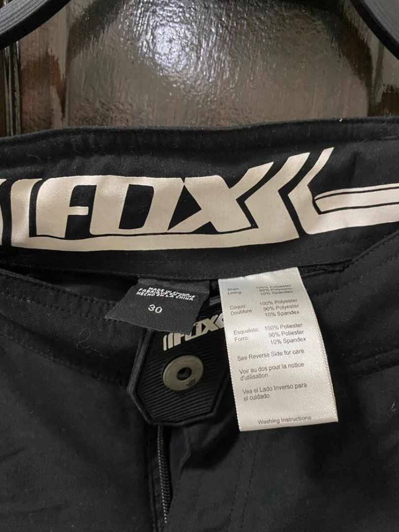 Fox Racing MTB Shorts (Category: Shorts) located in Manila. Submitted by haveago0dthrift (Listing ID 1435981270, Image 3). Description: - Black Fox Racing MTB shorts - Size 30 - Button and zipper closure - Two zippered pockets - Material: 100% polyester, 10% spandex - Includes washing instructions - Features Fox logo - Width 30 - Length 19.