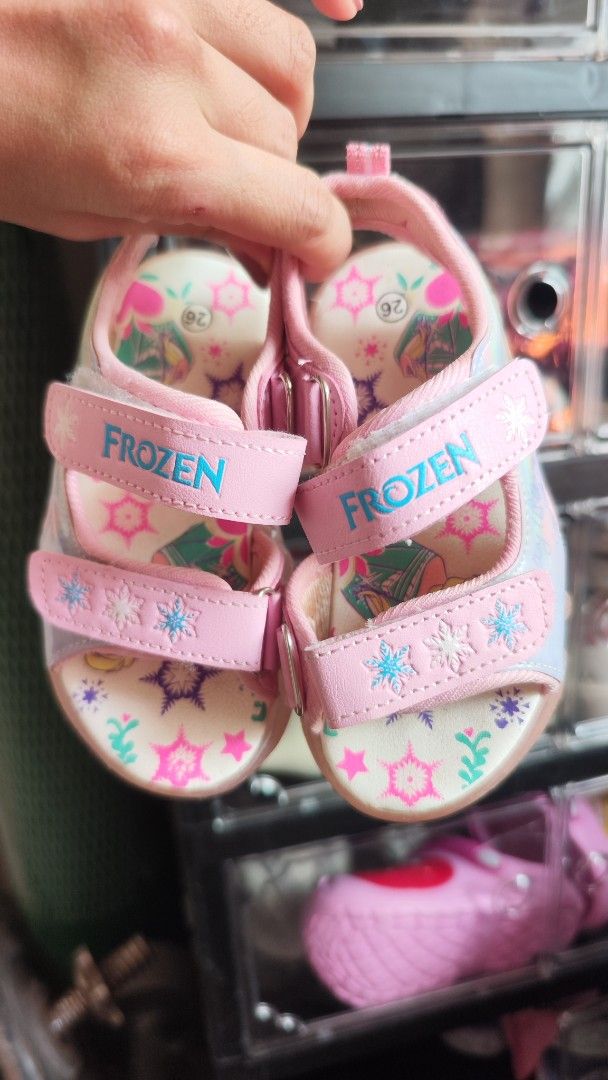 Frozen Sandals for Girls (Category: Babies & Kids Fashion) located in Cavite. Submitted by nesstuffandeverything (Listing ID 1435965515, Image 1). Description: - Adorable Frozen-themed sandals - Pink and blue color scheme - Features Frozen branding - Sole length: approximately 20cm - Velcro strap for adjustable fit - Perfect for Frozen fans!.