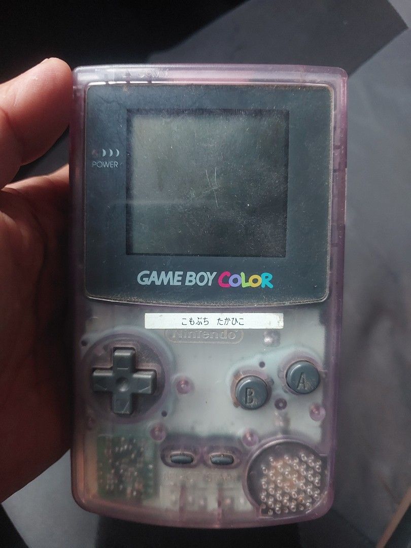 Game Boy Color - Clear Purple (Category: Nintendo) located in Quezon City. Submitted by jpnvintageonline (Listing ID 1435932962, Image 3). Description: - Game Boy Color in clear purple casing - Includes a game cartridge - Features visible buttons, D-pad, and screen - Shows the Game Boy Color logo - Battery compartment with batteries included - minor lcd issue .