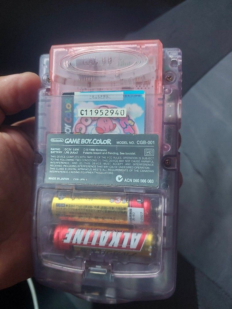 Game Boy Color - Clear Purple (Category: Nintendo) located in Quezon City. Submitted by jpnvintageonline (Listing ID 1435932962, Image 2). Description: - Game Boy Color in clear purple casing - Includes a game cartridge - Features visible buttons, D-pad, and screen - Shows the Game Boy Color logo - Battery compartment with batteries included - minor lcd issue .
