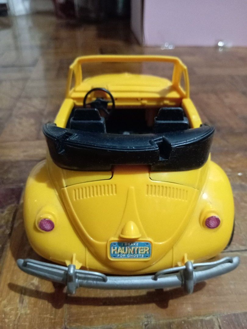 Ghostbusters Highway Haunter (Category: Vehicle & Diecast Models) located in Manila. Submitted by johnhunte48138 (Listing ID 1435982565, Image 2). Description: - Yellow Ghostbusters Beetle convertible toy car - Features the iconic Ghostbusters logo - License plate reads "I HAUNT FOR GHOSTS" - Black interior - Detailed engine compartment - Convertible top - Includes a front bumper working gimmick .