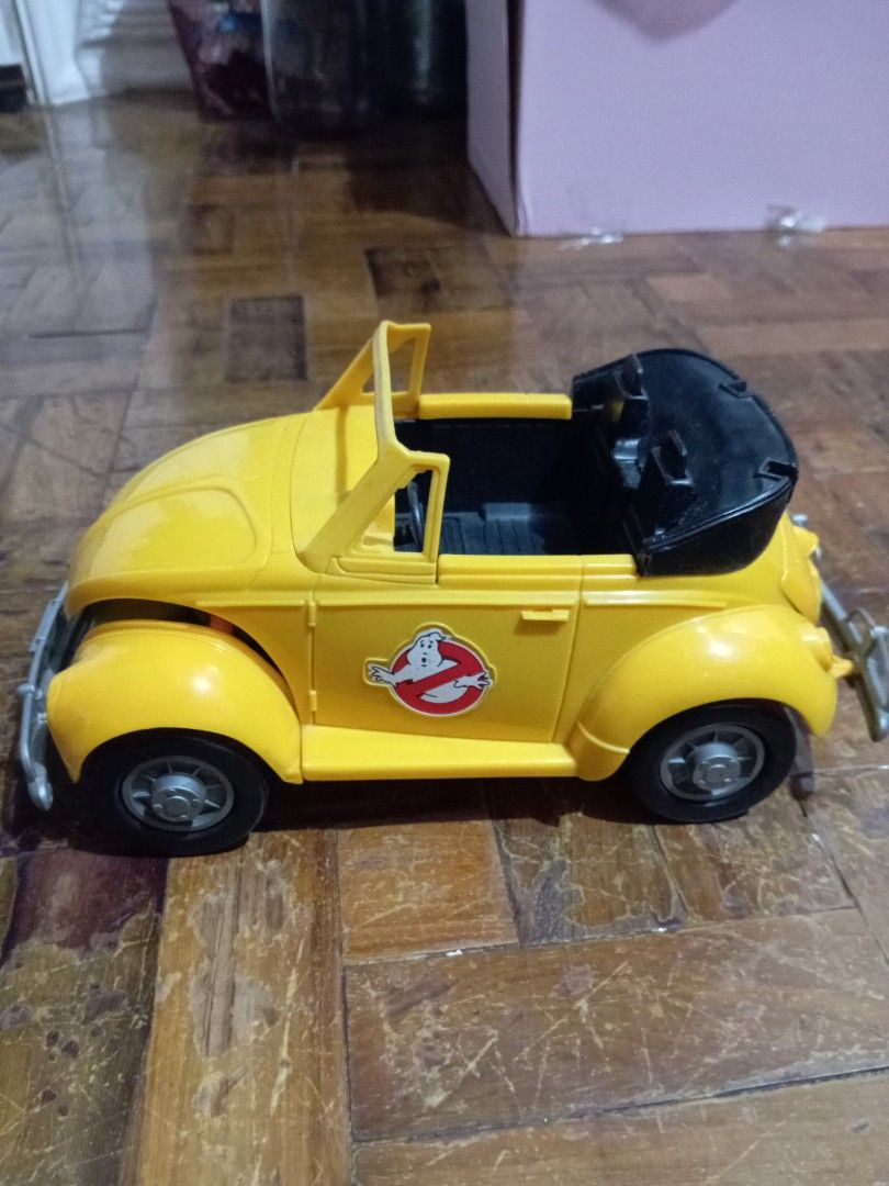 Ghostbusters Highway Haunter (Category: Vehicle & Diecast Models) located in Manila. Submitted by johnhunte48138 (Listing ID 1435982565, Image 1). Description: - Yellow Ghostbusters Beetle convertible toy car - Features the iconic Ghostbusters logo - License plate reads "I HAUNT FOR GHOSTS" - Black interior - Detailed engine compartment - Convertible top - Includes a front bumper working gimmick .