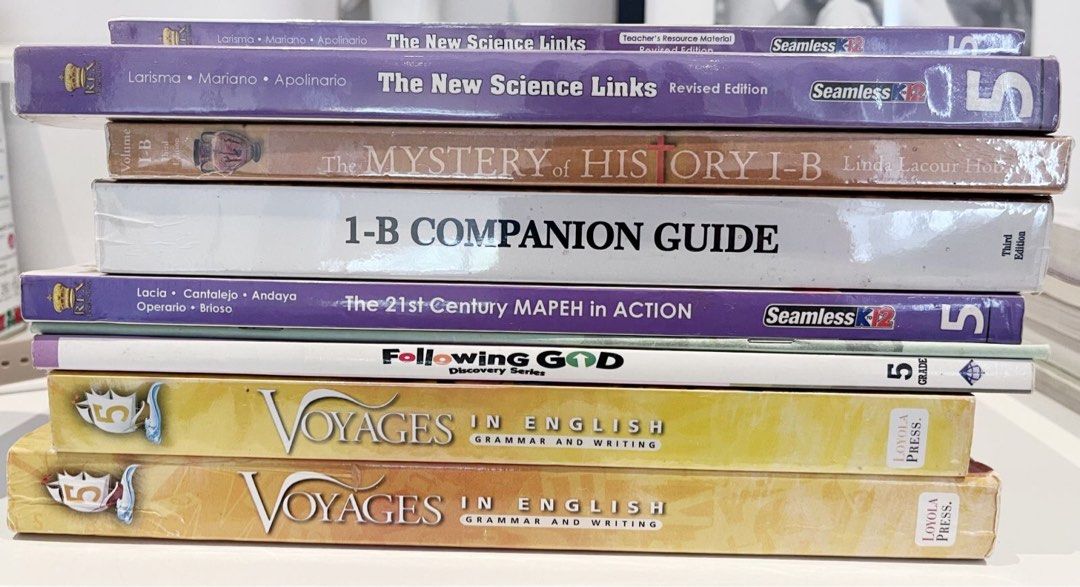 Grade 5 School Books (Category: Textbooks) located in Quezon City. Submitted by hanahana24 (Listing ID 1436010275, Image 1). Description: Collection of educational books including: - The New Science Links (WB,TM) ₱1500 - The Mystery of History I-B & 1-B Companion Guide ₱1500 -The 21st Century MAPEH in Action ₱500 -Following God (WB,TM) ₱900 -Voyages in English (WB,TM) ₱1500.