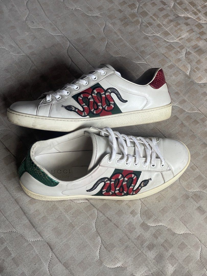 Gucci Ace Sneakers with Snake Embroidery (Category: Sneakers) located in Dasmarinas. Submitted by prerogathrift (Listing ID 1436033549, Image 1). Description: Gucci Ace Embroidered Snake 26.5cm - Gucci Ace sneakers - White leather upper - Snake embroidery detail - Green and red stripe detail - Green and red heel tabs - White laces - Rubber sole - Gucci logo on insole.