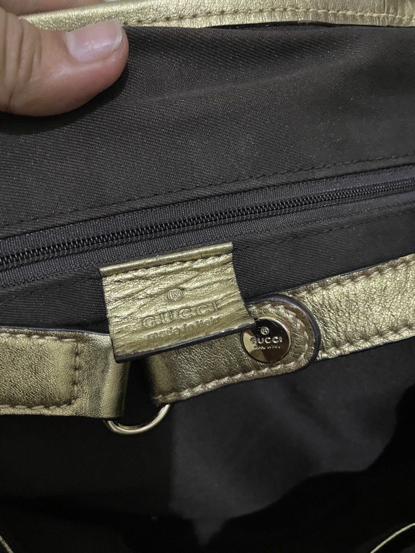 Gucci Brown and Gold Handbag (Category: Luxury Bags & Wallets) located in Manila. Submitted by triciabugtong (Listing ID 1436047977, Image 3). Description: - Authentic Gucci handbag - Iconic GG monogram pattern - Brown fabric body - Gold-colored accents - Classic tote style - Zipper closure - Interior Gucci logo - Serial number: "161718".