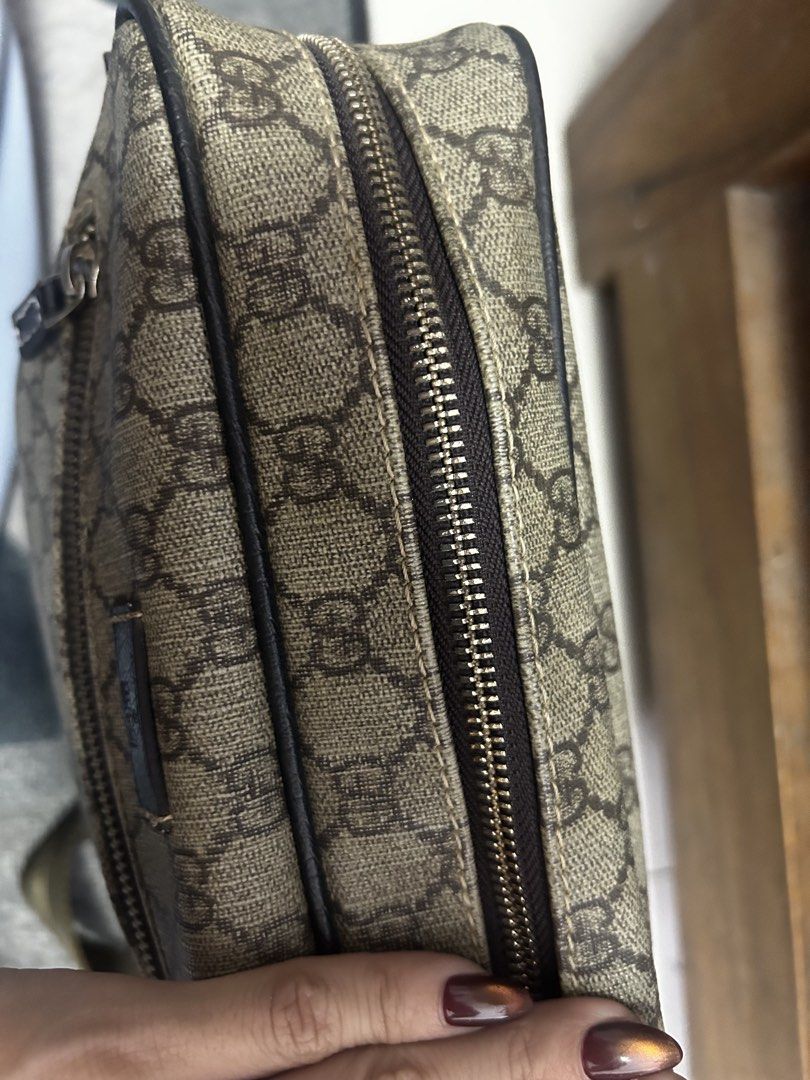 Gucci GG Supreme Shoulder Bag (Category: Luxury Bags & Wallets) located in Lucena. Submitted by blush_lux (Listing ID 1436058197, Image 3). Description: - Gucci messenger shoulder bag -With serial code 201448 8583 - Iconic GG Supreme canvas - Secure zip closure - Gucci under zip - Adjustable shoulder strap - Includes small leather Gucci logo tag - Lined interior - Classic and versatile design.