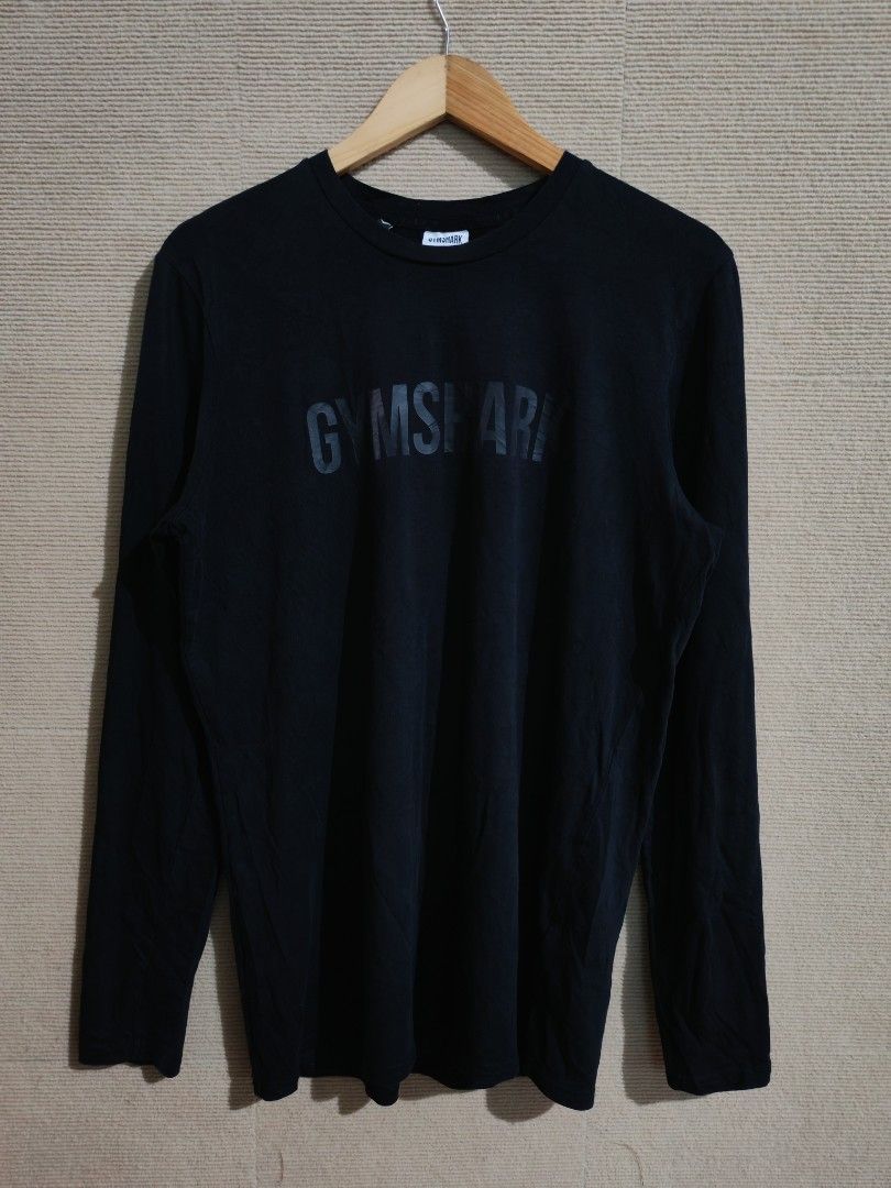 Gym shark longsleeve black spell out (Category: Swim Top & Rash Guards) located in Iligan City. Submitted by wantwears14 (Listing ID 1435932489, Image 1). Description: Good as new with size tag No issue on print Bagong bago and super black in person.