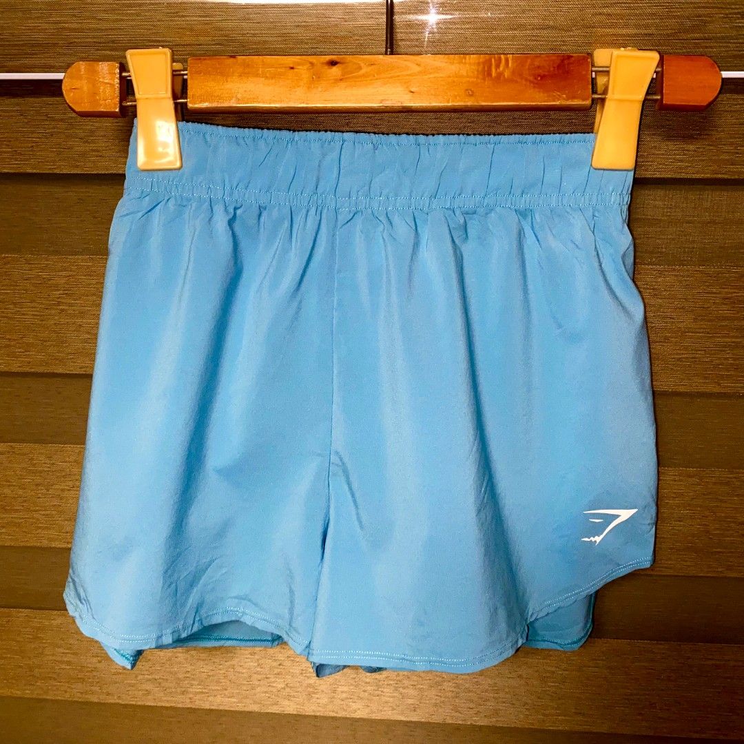 Gymshark Running Shorts - Blue - Size S (Category: Activewear) located in Manila. Submitted by safehawk-c9a684 (Listing ID 1435950345, Image 1). Description: - Gymshark running shorts - Vibrant blue color - Size: S - Features Gymshark logo - Made in Cambodia - Elastic waistband - Perfect for workouts or casual wear.