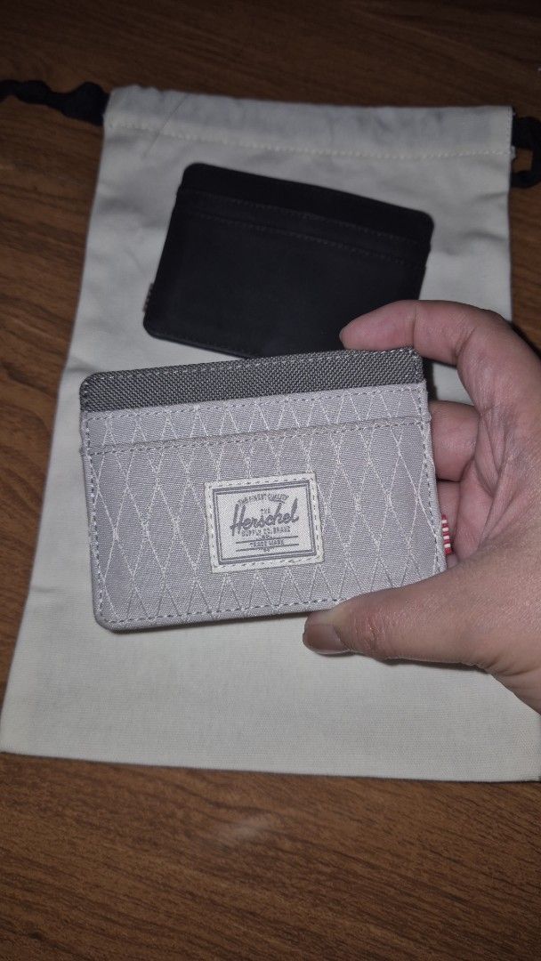 Herschel charlie Cardholder (Category: Wallets & Card holders) located in Valenzuela. Submitted by 0105pml (Listing ID 1436012015, Image 1). Description: - Herschel cardholder - Gray color - Features multiple card slots - Includes dust bag - Diamond pattern on front - Gray interior.