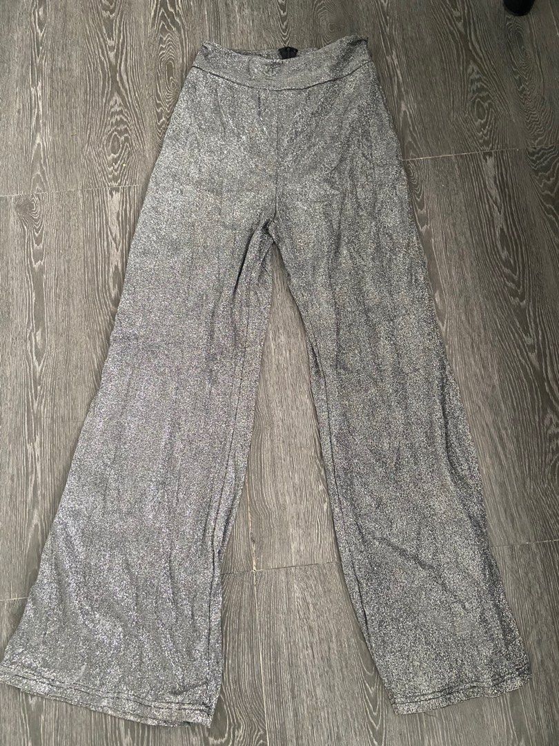 High waist wide leg pants (Category: Jeans) located in Bacoor. Submitted by jp.13 (Listing ID 1435995918, Image 1). Description: FOR SALE❗️ Flare elastic rear zipper trouser Silver Glittery Used once on a event Slight Nego Payment first via gcash or bank transfer MOD: LBC or lalamove (buyer’s expense) Location: Cavite DM for more info .
