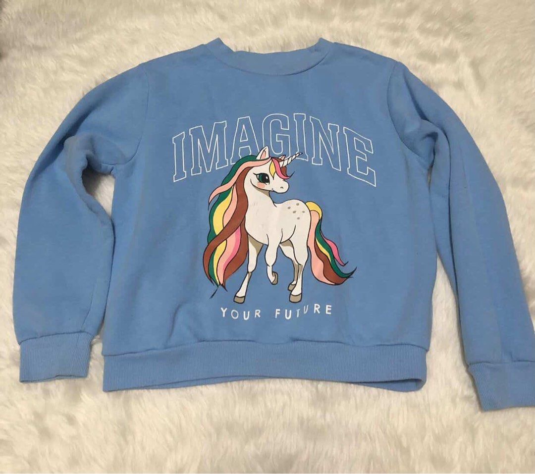 H&M Light Blue Unicorn Print Sweatshirt (Category: Babies & Kids Fashion) located in Pasig City. Submitted by trendsinstyle (Listing ID 1436088692, Image 1). Description: Light blue Unicorn Print H&M sweatshirt size EUR 122/128, US 6X/7, CA 6-8A, and AUS 7-8, UK 6-8Y..