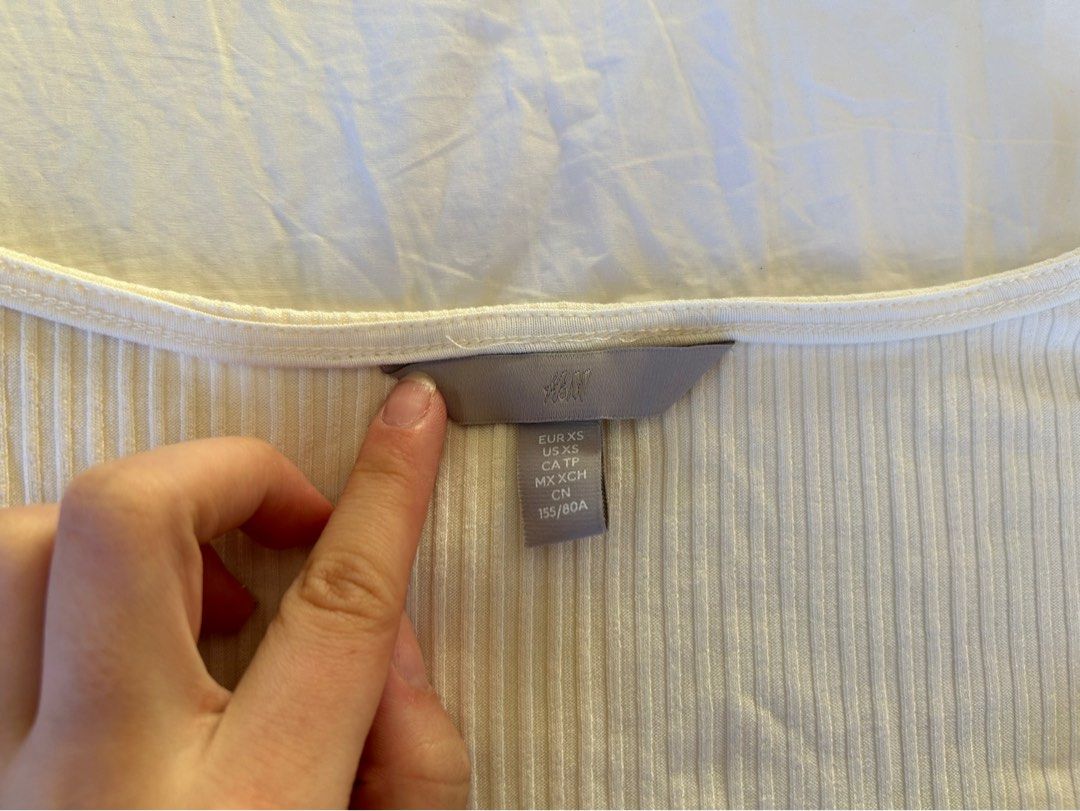 H&M Ribbed Long Sleeve Top XS (Category: Longsleeves) located in Makati City. Submitted by swedishcandy (Listing ID 1436097645, Image 3). Description: - Cream long-sleeved top - Ribbed texture - Scoop neckline with small slit - Fitted silhouette - Stretchy material.