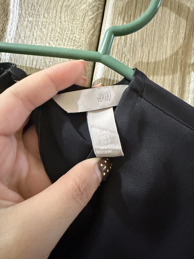 H&M semi formal Black Blouse (Category: Blouses) located in Makati City. Submitted by marj_declutters (Listing ID 1436021655, Image 2). Description: - H&M black blouse - Size: S - Features: - Long sleeves with cuff details - Round neckline - Pleated front design .