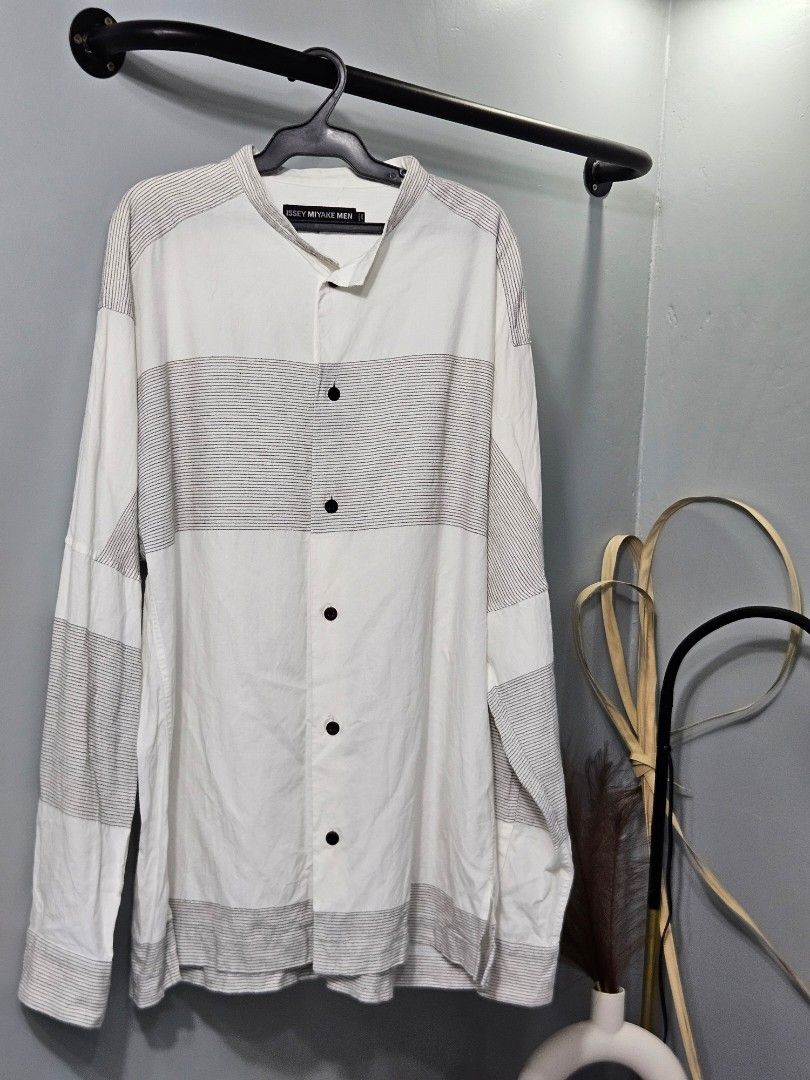 Issey Miyake Men Button Down Shirt (Category: Tshirts & Polo Shirts ) located in Candon. Submitted by itssummer08 (Listing ID 1436000380, Image 1). Description: Excellent Condition Issey Miyake Button Down polo. One missing button on left Cuff. Made in Japan, not faded. Very presentable. Kept only in the Cabinet 29 x 22.