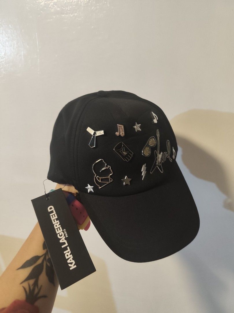 Karl Lagerfeld Black Cap with Embellishments (Category: Caps & Hats) located in Manila. Submitted by margamarti35560 (Listing ID 1436087167, Image 1). Description: - Karl Lagerfeld black cap - Features decorative embellishments - Brand new with original tag - Stylish accessory for daily use.