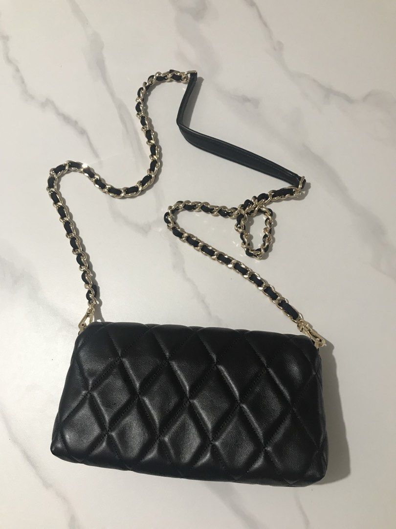 Kate Spade Black Quilted Mini Shoulder Bag (Category: Luxury Bags & Wallets) located in Quezon City. Submitted by jergaragesale (Listing ID 1436009361, Image 2). Description: - Kate Spade black quilted mini shoulder bag - Gold-tone chain strap with leather shoulder rest - Rectangular shape with flap closure - Gold-tone clasp with Kate Spade logo - looks new, what u see is what u get.