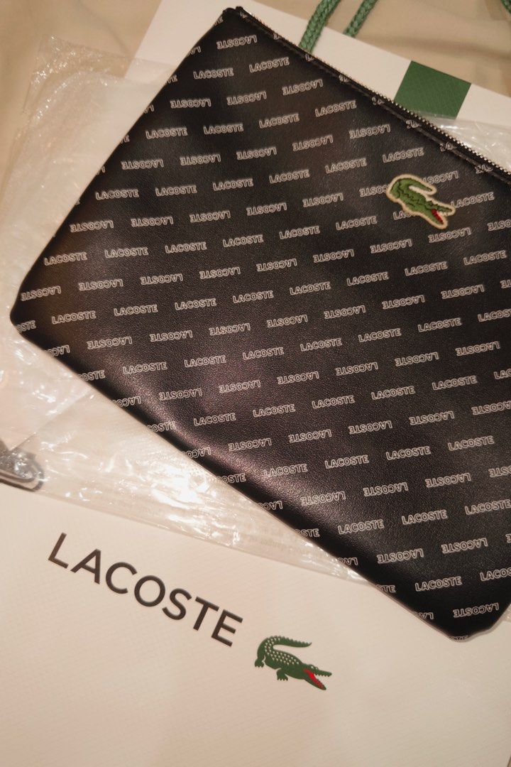 Lacoste Clutch Bag (Category: Luxury Bags & Wallets) located in Muntinlupa City. Submitted by goldlevel (Listing ID 1436074716, Image 3). Description: Monogram Lacoste Clutch Bag Blue Lining Inside.