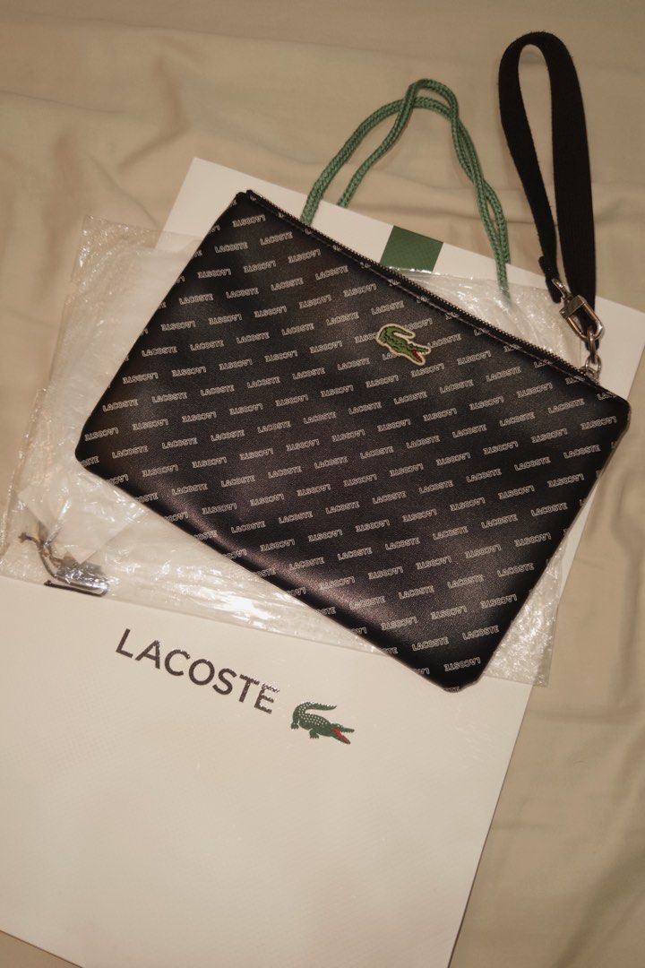 Lacoste Clutch Bag (Category: Luxury Bags & Wallets) located in Muntinlupa City. Submitted by goldlevel (Listing ID 1436074716, Image 1). Description: Monogram Lacoste Clutch Bag Blue Lining Inside.