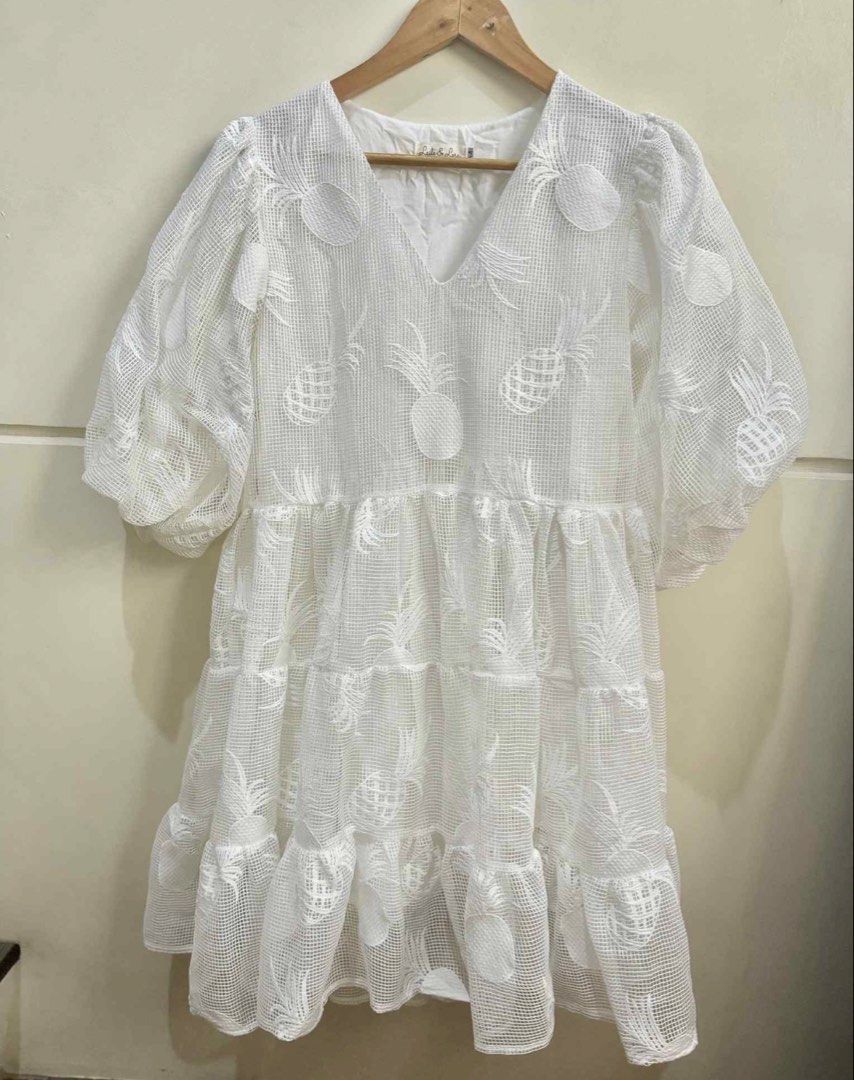 Laila & Lyra Sandrine Twinning (Category: Babies & Kids Fashion) located in San Juan City. Submitted by lovedbymaiagia (Listing ID 1435997103, Image 2). Description: Laila & Lyra Sandrine Matching mother-daughter dress set White, textured fabric with pineapple embroidery Adult dress: V-neck, tiered skirt, medium Child's romper: puff sleeves, tie detail at back, size 3 .