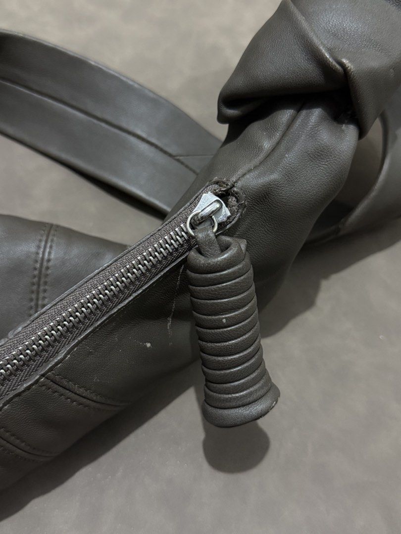 Lemaire Croissant Soft Leather Shoulder Bag (Category: Sling Bags) located in Manila. Submitted by coachmethen (Listing ID 1436065805, Image 3). Description: LEMAIRE Made in Spain soft leather genuine leather material silver tone hardware grey / dark gray small size can fit iphone promax “slightly negotiable”.