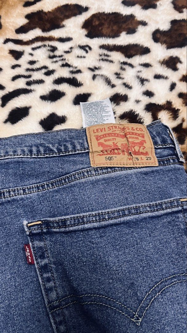 Levi's 505 Jeans - W36 L29 (Category: Jeans) located in Cabuyao City. Submitted by kisyana (Listing ID 1436052044, Image 3). Description: - Levi's 505 jeans - Medium wash - Straight leg fit - Size: W36 L29 - Button and zipper closure - Features the Levi's red tab - Minor stain on front.