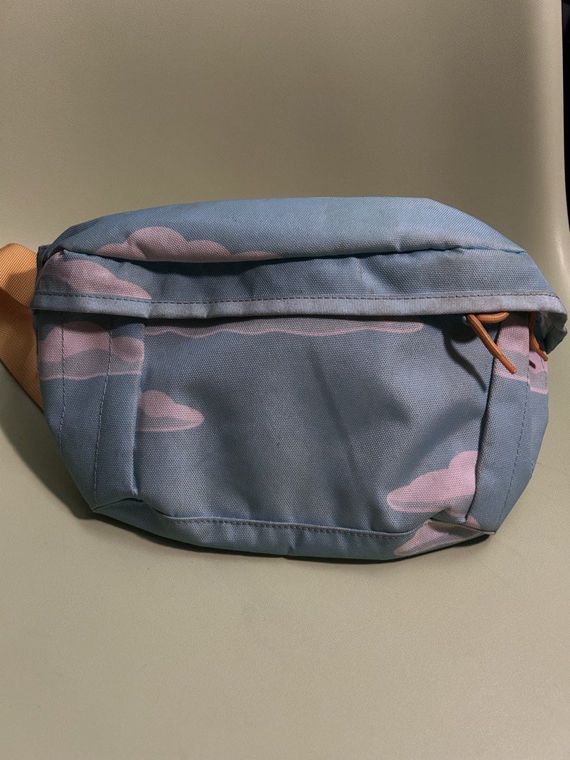 Levi's x The Simpsons Fanny Pack (Category: Cross-body Bags) located in Paranaque City. Submitted by username300 (Listing ID 1435975466, Image 1). Description: - Cloud pattern fanny pack - Levi's x The Simpsons collaboration patch - Zippered main compartment - Adjustable strap - Light blue base color - Yellow strap - Stylish and functional.