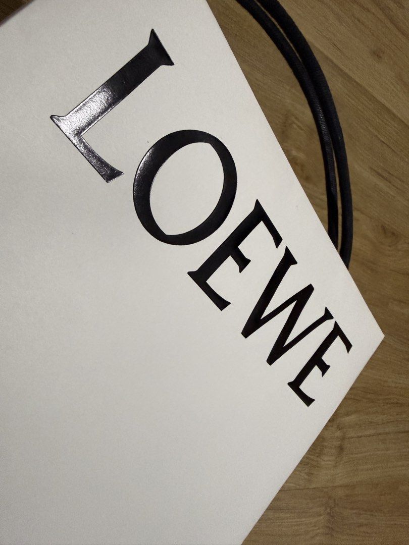 Loewe Shopping Bag (Category: Craft Supplies & Tools) located in Valenzuela. Submitted by minami34 (Listing ID 1436029994, Image 2). Description: - Authentic Loewe Shopping Bag - Classic white color - Features the iconic LOEWE logo (Embossed) - Ideal for gifting or personal use Dimensions: (L- 30.9cm x W- 23.9cm x D - 8cm) Reason for selling: Declutter Note: Shipping Fee (SF) still not included. Mode of Payment: Bank Transfer (BDO/BPI) or GCash D
