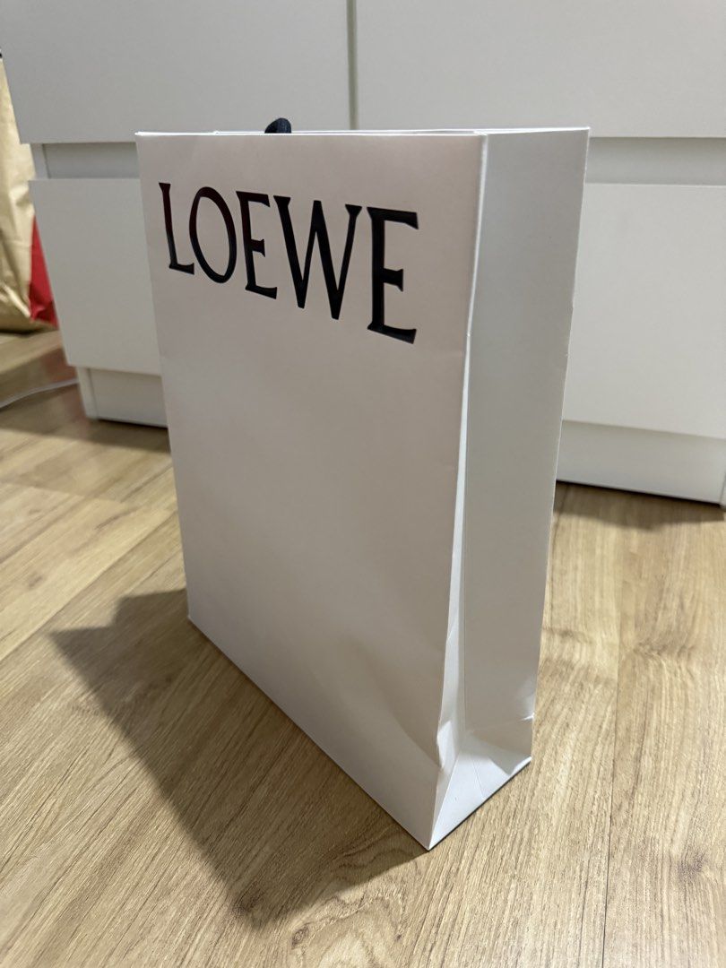 Loewe Shopping Bag (Category: Craft Supplies & Tools) located in Valenzuela. Submitted by minami34 (Listing ID 1436029994, Image 3). Description: - Authentic Loewe Shopping Bag - Classic white color - Features the iconic LOEWE logo (Embossed) - Ideal for gifting or personal use Dimensions: (L- 30.9cm x W- 23.9cm x D - 8cm) Reason for selling: Declutter Note: Shipping Fee (SF) still not included. Mode of Payment: Bank Transfer (BDO/BPI) or GCash D