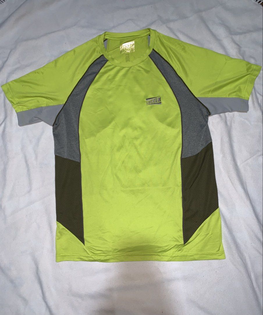 Lukken Athletic Shirt (Category: Tshirts & Polo Shirts ) located in Baguio. Submitted by brix6699 (Listing ID 1435972920, Image 1). Description: - Neon green athletic shirt - Gray and olive green accents - "Lukken" logo on front and back - Breathable, possibly moisture-wicking material - Crew neck - Short sleeves - Ideal for sports and casual activities Dimensions Length 26.5 inches Width 19 inches .