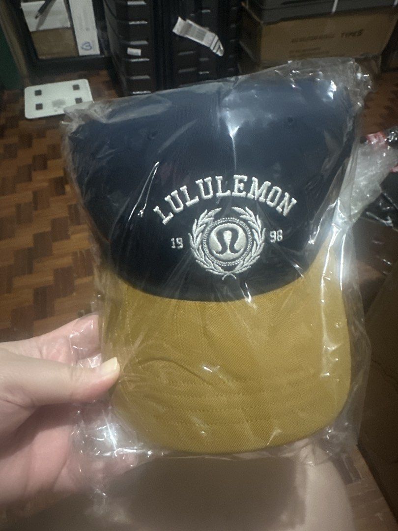 SUPER SALE Original Brand New Lululemon Cap L/ XL (Category: Caps & Hats) located in Quezon City. Submitted by peach_o (Listing ID 1436017397, Image 1). Description: - Lululemon cap - Color: Navy blue top, mustard yellow brim - Features embroidered Lululemon logo - Brand new.