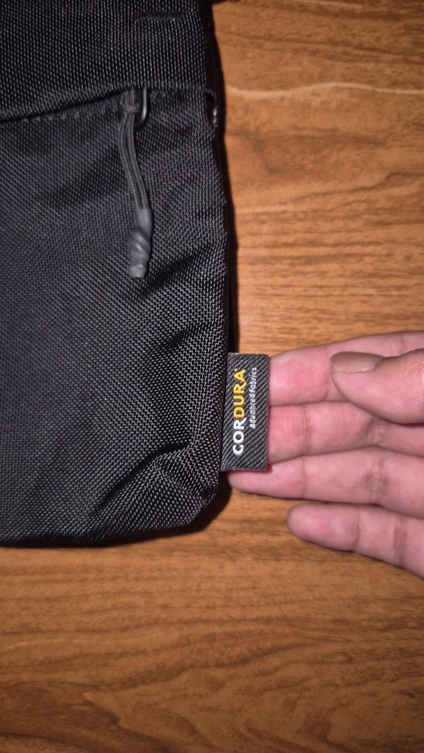 MAGEASY Cordura Sling Bag (Category: Sling Bags) located in Valenzuela. Submitted by 0105pml (Listing ID 1436013465, Image 2). Description: BOUGHT IN TAIWAN AIRPORT - Black Cordura sling bag - Zippered main compartment - Adjustable shoulder strap - Multiple internal compartments - Ideal for phone, wallet, and small items - Compact and suitable for daily use.