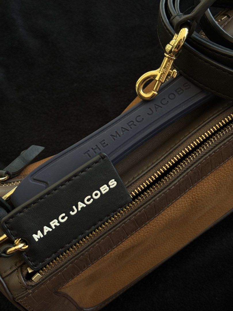 MARC JACOBS - The Soft Box 23 Bag in Brown Multi (Category: Luxury Bags & Wallets) located in Agoncillo. Submitted by jamesrdez (Listing ID 1435935988, Image 3). Description: NEGOTIABLE - Marc Jacobs The Softbox 23 bag - Bought from Marc Jacobs Sample Sale ( see sample tag) - still available online for 400+ dollars - Color: Brown and Tan - Detachable black strap with gold hardware - Blue handle with "THE MARC JACOBS" print - Rectangular shape wit