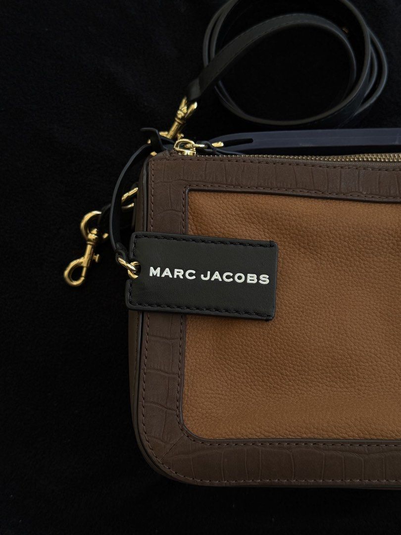 MARC JACOBS - The Soft Box 23 Bag in Brown Multi (Category: Luxury Bags & Wallets) located in Agoncillo. Submitted by jamesrdez (Listing ID 1435935988, Image 1). Description: NEGOTIABLE - Marc Jacobs The Softbox 23 bag - Bought from Marc Jacobs Sample Sale ( see sample tag) - still available online for 400+ dollars - Color: Brown and Tan - Detachable black strap with gold hardware - Blue handle with "THE MARC JACOBS" print - Rectangular shape wit