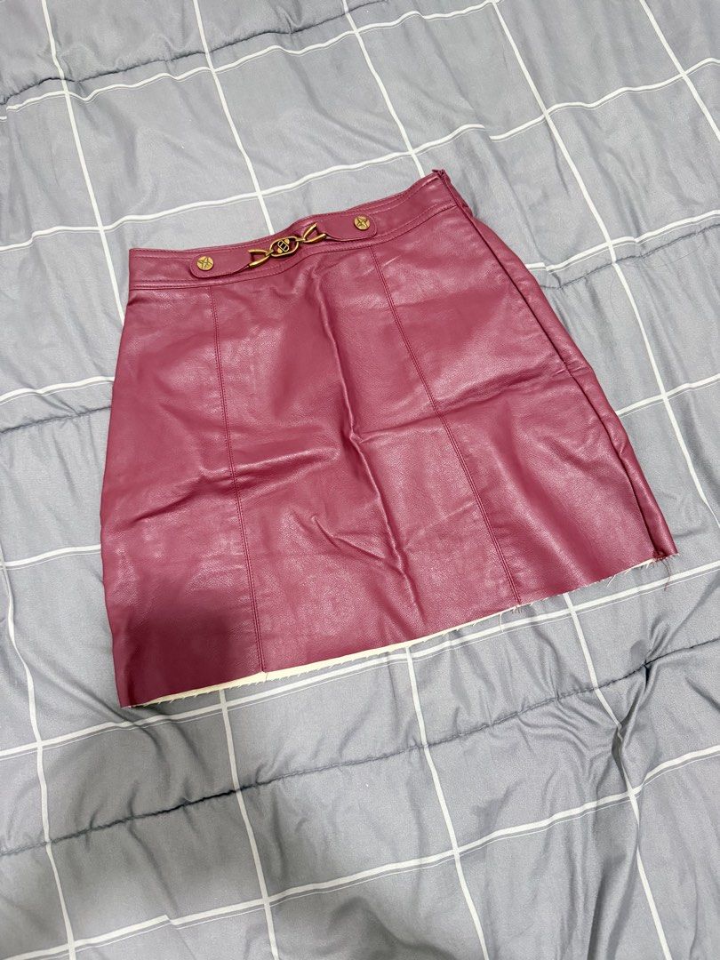 Maroon Faux Leather Skirt (Category: Skirts) located in Makati City. Submitted by nicsxxxx (Listing ID 1436057974, Image 2). Description: - SHEIN faux leather skirt - Eye-catching pink color - Stylish gold-tone buckle detail - Classic A-line design - Convenient zipper closure - Size: XS (EU 32, US 2).