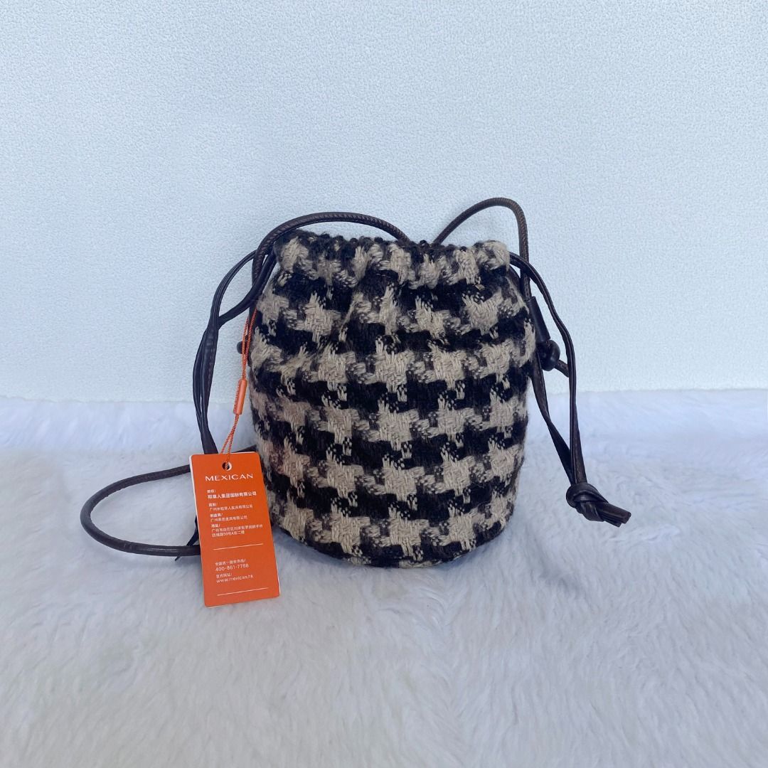 Mexican Black Ivory White Wool Bucket Bag (Category: Cross-body Bags) located in Cebu City. Submitted by posh_avenue888 (Listing ID 1436031744, Image 1). Description: Brand new. From Japan. Crafted in wool fabric. 100% authentic!!! 5.5" x 7" x 5.5"..