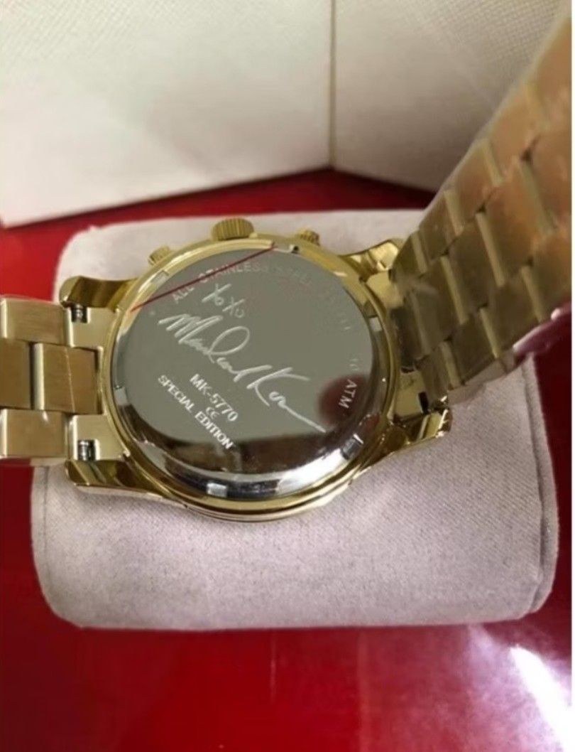 Michael Kors Special Edition Gold Watch (Category: Women's Watches) located in Manila. Submitted by queens_koleksyon07 (Listing ID 1435947617, Image 2). Description: - Gold-tone stainless steel bracelet and case - Gold watch face with three sub-dials - Date window - 'Michael Kors Special Edition' engraved on the back - Comes with original Michael Kors box.