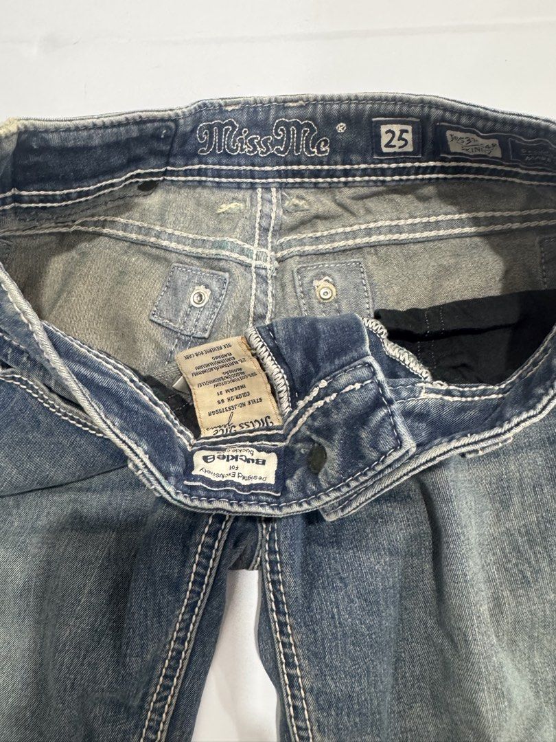 Miss Me Y2K Jeans Size 25 (Category: Jeans) located in Cebu City. Submitted by oryenz (Listing ID 1436040439, Image 3). Description: - Miss Me Y2K jeans - Size 25 waist - 29" width, 38" length - Slightly faded denim wash - Embellished back pockets - Button and zipper closure.