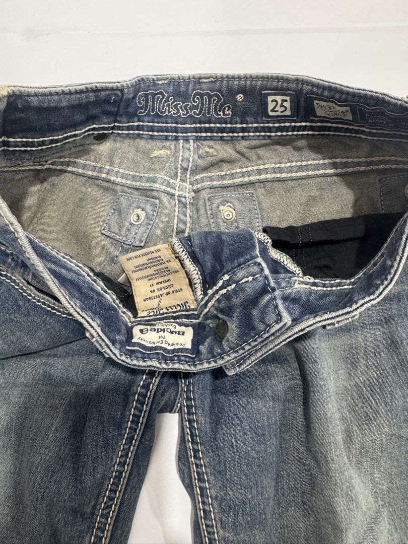 Miss Me Y2K Jeans Size 25 (Category: Jeans) located in Cebu City. Submitted by oryenz (Listing ID 1436040439, Image 2). Description: - Miss Me Y2K jeans - Size 25 waist - 29" width, 38" length - Slightly faded denim wash - Embellished back pockets - Button and zipper closure.