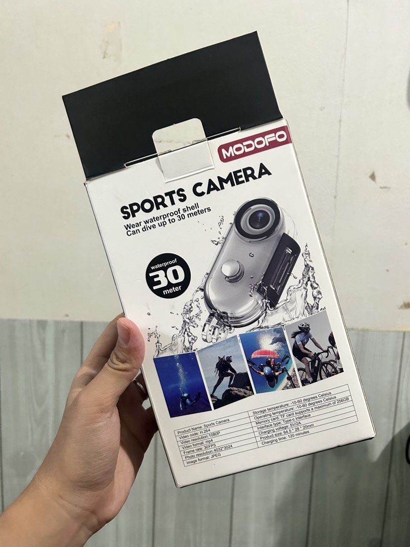 MODOFO Sports Camera Waterproof 30m (Category: Cameras) located in Cabanatuan. Submitted by cristina2 (Listing ID 1435984402, Image 1). Description: MODOFO sports camera comes with a waterproof shell and can dive up to 30 meters. It features a TF card slot and a charging time of 120 minutes. The box indicates it can record video in 1080P resolution. Perfect for capturing underwater adventures and other sports activities. Bought it on Feb. 7. Once
