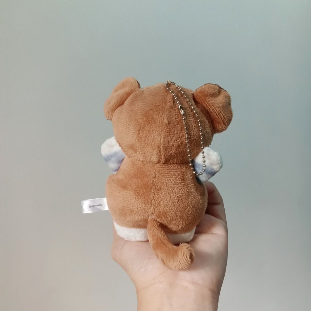 Mofusand Cat in Monkey Costume Plush Charm (Category: Plushies & Soft Toys) located in Noveleta. Submitted by forgetti00 (Listing ID 1435916316, Image 2). Description: Adorable Mofusand cat plushie wearing a monkey costume. Features a cute embroidered face with big eyes and a small pink nose. The plush has a soft, brown and beige color scheme. Includes a tag that says "mofusand". Perfect for cat lovers and collectors..