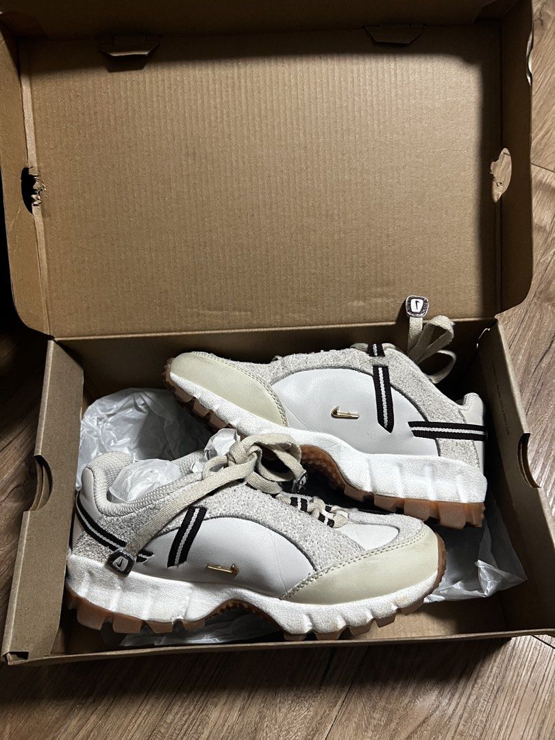 Nike Air Humara LX Jacquemus (Category: Sneakers) located in Manila. Submitted by binigurrl (Listing ID 1436044829, Image 1). Description: - Nike Air Humara LX sneakers - Colorway: Light bone/gold-sail - Size: US 5.5, UK 3, EUR 36, 22.5 cm - Features white and beige design with black accents - Includes original box with Jacquemus logo.