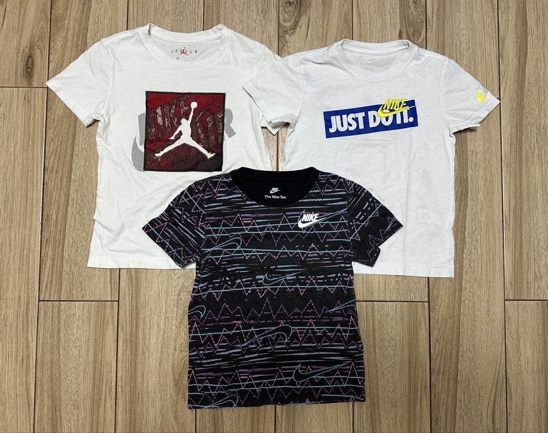 Nike and Jordan T-shirts (Category: Tshirts & Polo Shirts ) located in Manila. Submitted by sircee6 (Listing ID 1436044932, Image 1). Description: - 5-6 y/o as pack - White Jordan shirt with red and black graphic. - White Nike shirt with blue and yellow "JUST DO IT" graphic. - Black Nike shirt with patterned design and white Nike logo..