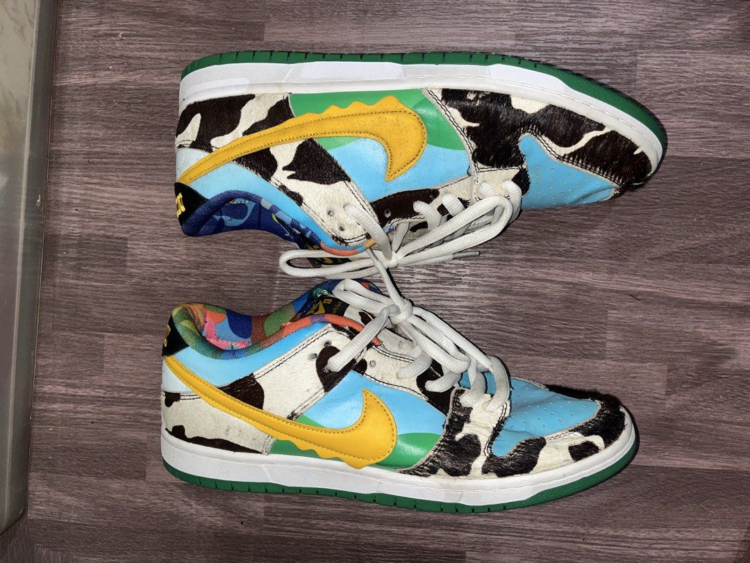 Nike SB Dunk Low x Ben & Jerry's Chunky Dunky (Category: Sneakers) located in Carmen. Submitted by by_your_stuff (Listing ID 1436057127, Image 2). Description: - Nike SB Dunk Low 'Chunky Dunky' collaboration with Ben & Jerry's. - Unique design with cowhide-like patterns. - Blue sky overlays. - Yellow swooshes. - Colorful tongue design. - Nike logo on the heel. - Green sole. - Nike SB Chunky Dunky logo on the insole..